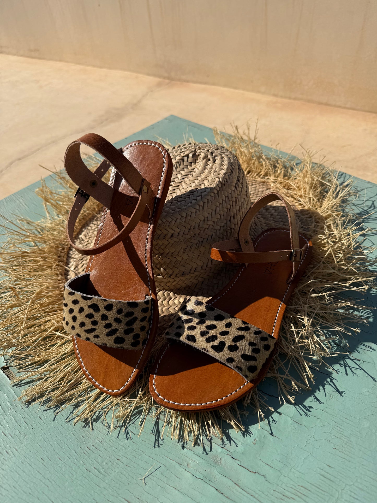 Handmade leather sandals with animal print