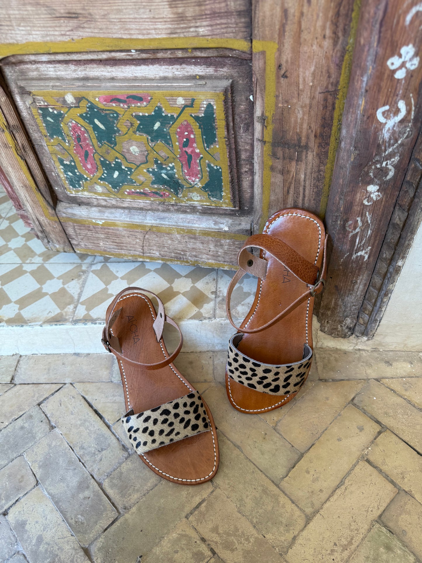 Handmade leather sandals with animal print
