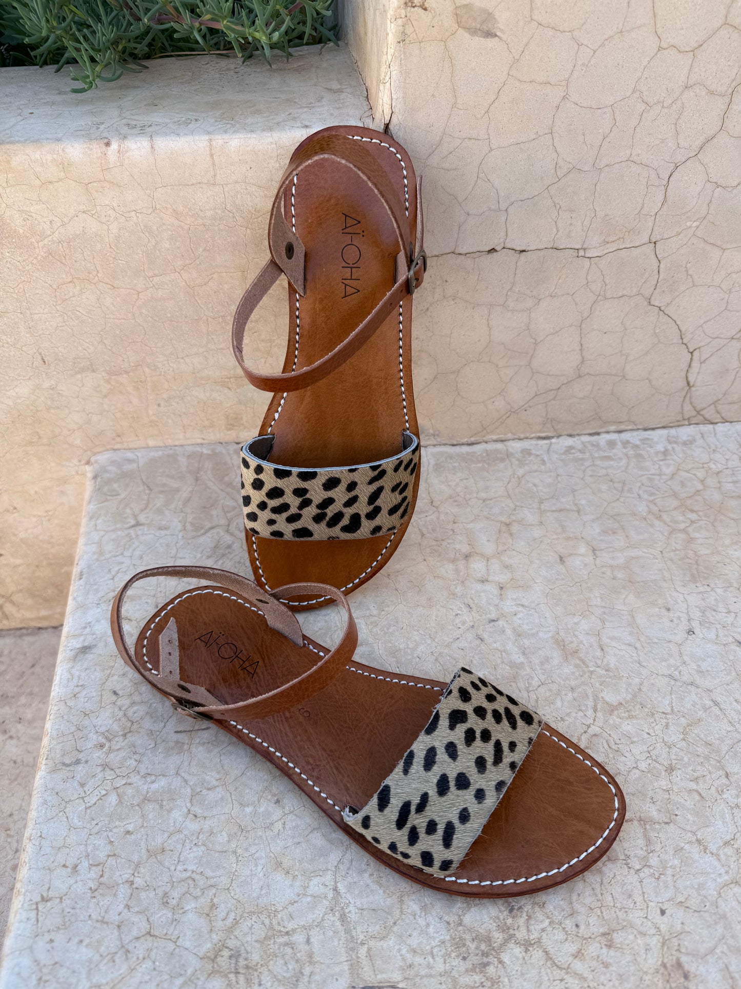 Handmade leather sandals with animal print