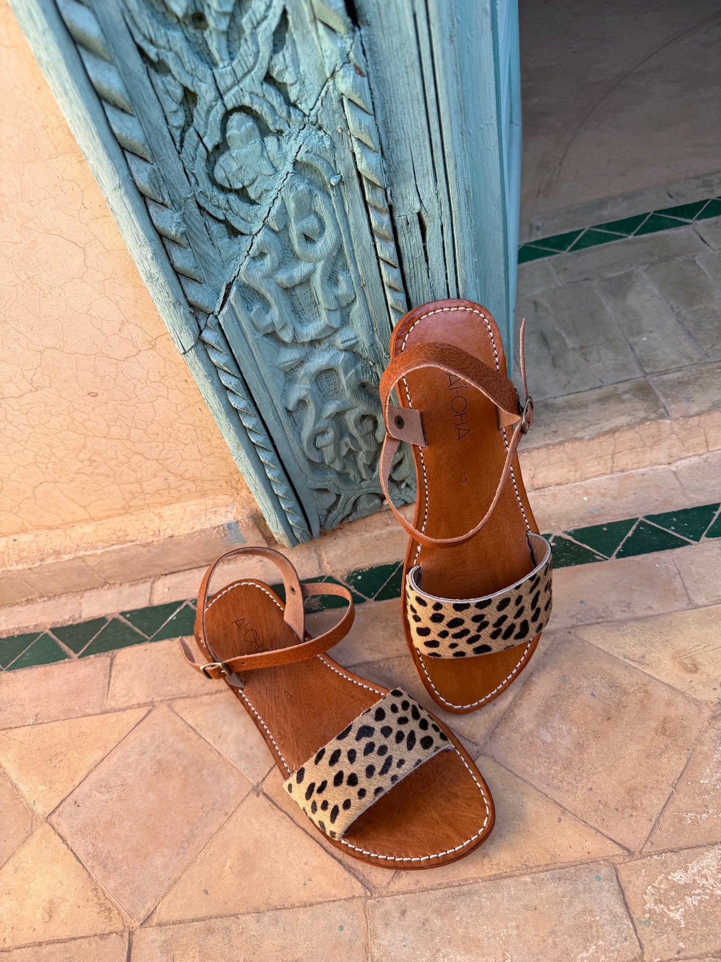 Handmade leather sandals with animal print